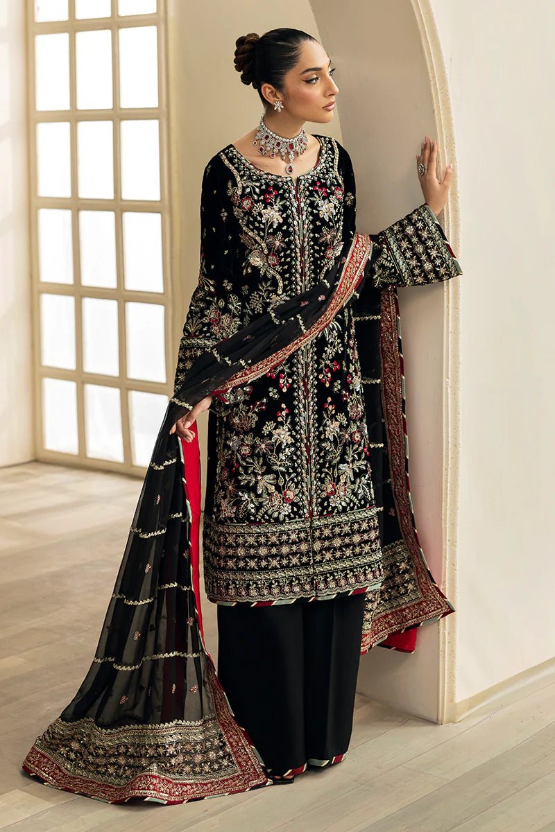 Model wearing Raven from Gulaal's Celeste Unstitched Velvet '24 collection in deep black. Luxury pret, festive, Pakistani clothes online in UK.