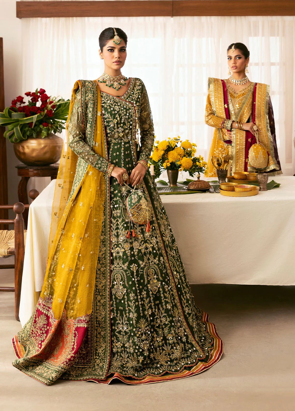 Model wearing Gulaal Maahru deep green and mustard embroidered wedding lehenga with intricate embellishments and contrasting dupatta. Shop Pakistani clothes online in the UK now.