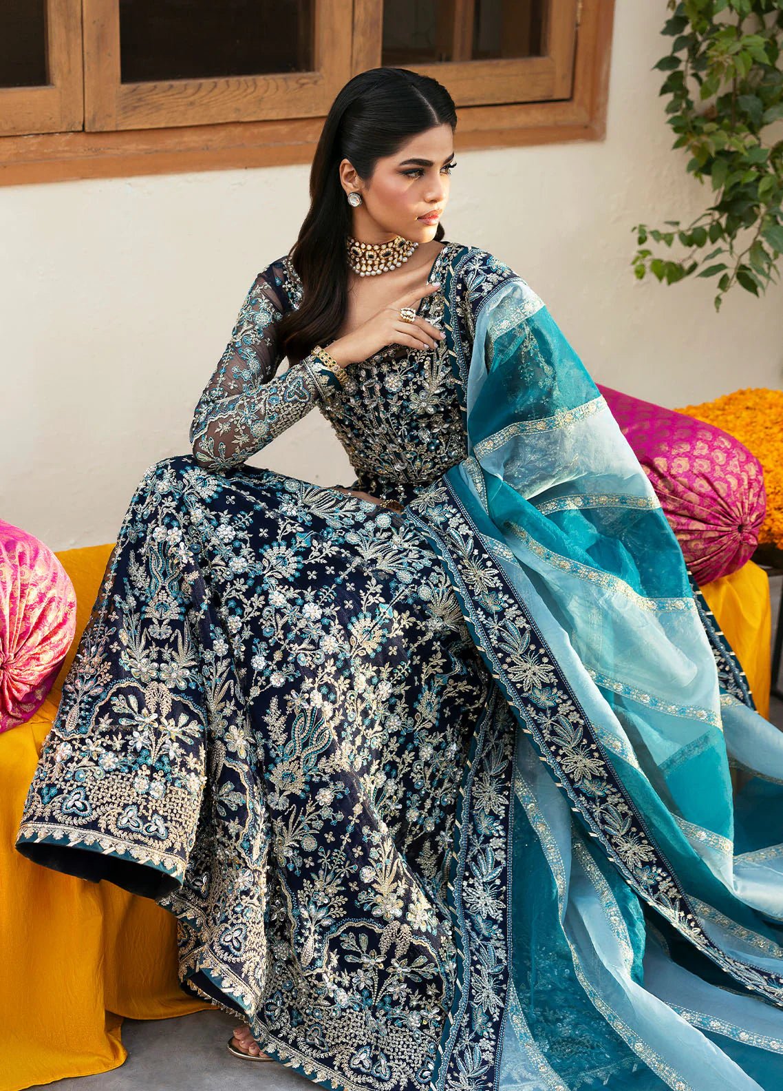 Model wearing Gulaal Meena navy blue embroidered chiffon dress with intricate embellishments and matching dupatta. Shop Pakistani clothes online in the UK now.