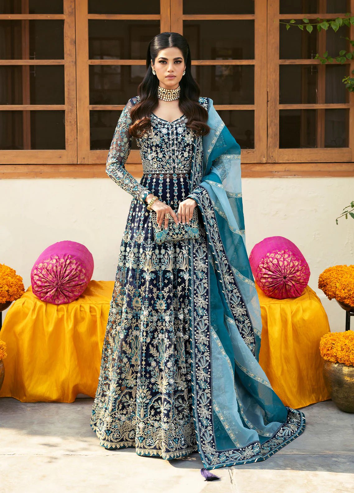 Model wearing Gulaal Meena navy blue embroidered chiffon dress with intricate embellishments and matching dupatta. Shop Pakistani clothes online in the UK now.