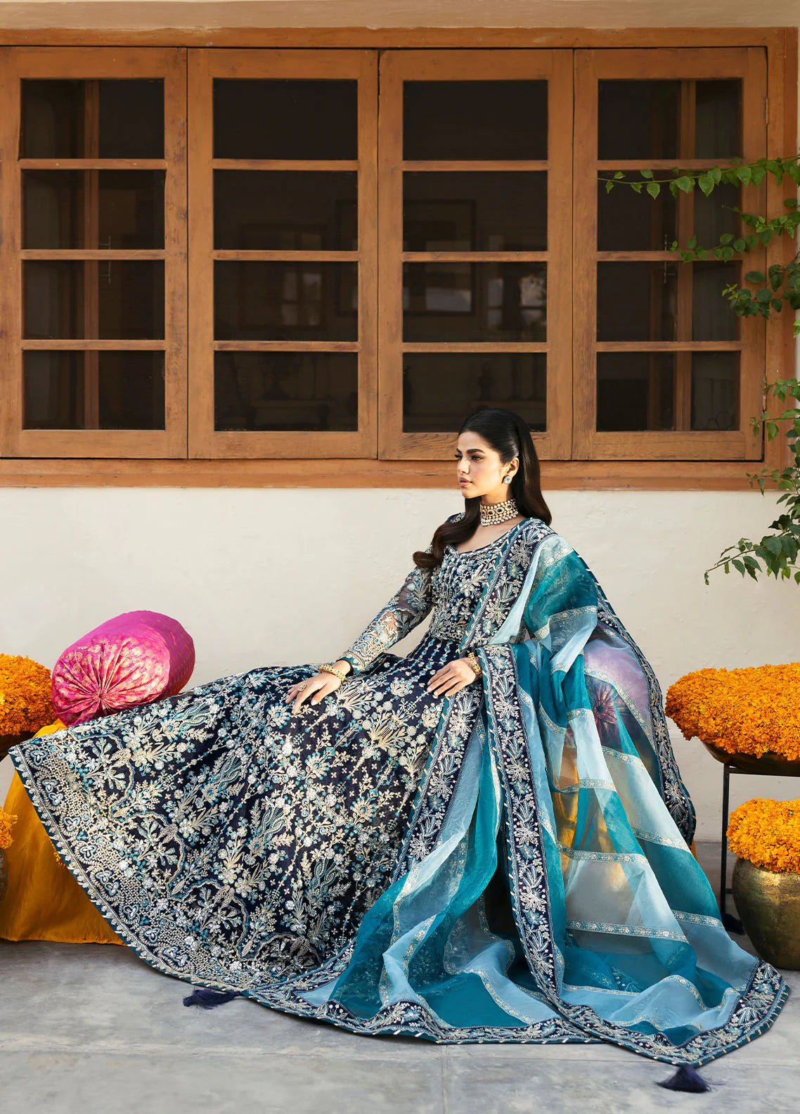 Model wearing Gulaal Meena navy blue embroidered chiffon dress with intricate embellishments and matching dupatta. Shop Pakistani clothes online in the UK now.