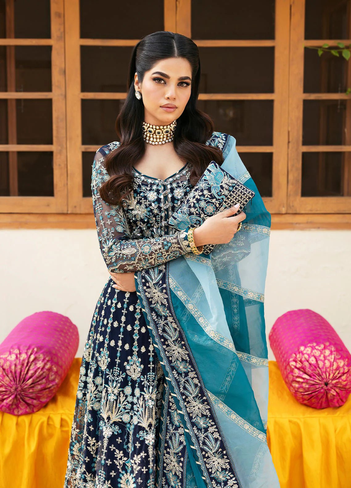 Model wearing Gulaal Meena navy blue embroidered chiffon dress with intricate embellishments and matching dupatta. Shop Pakistani clothes online in the UK now.