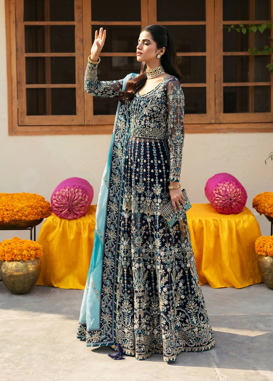 Model wearing Gulaal Meena navy blue embroidered chiffon dress with intricate embellishments and matching dupatta. Shop Pakistani clothes online in the UK now.