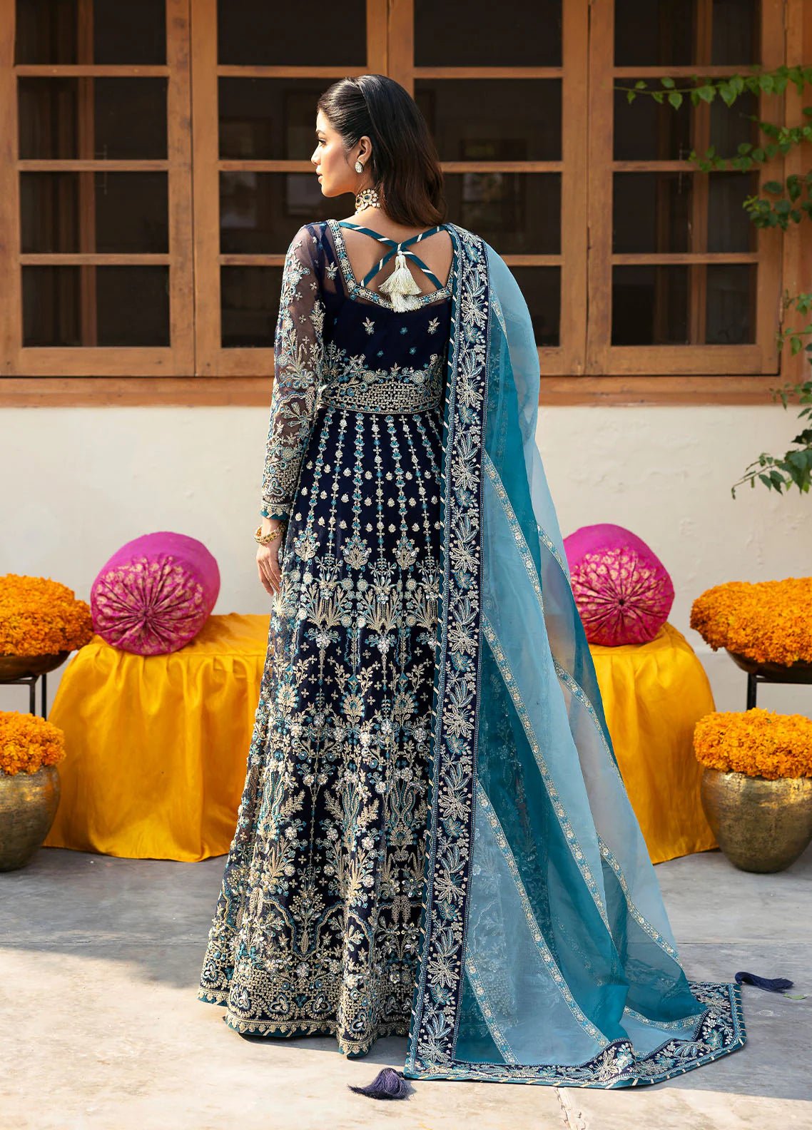 Model wearing Gulaal Meena navy blue embroidered chiffon dress with intricate embellishments and matching dupatta. Shop Pakistani clothes online in the UK now.