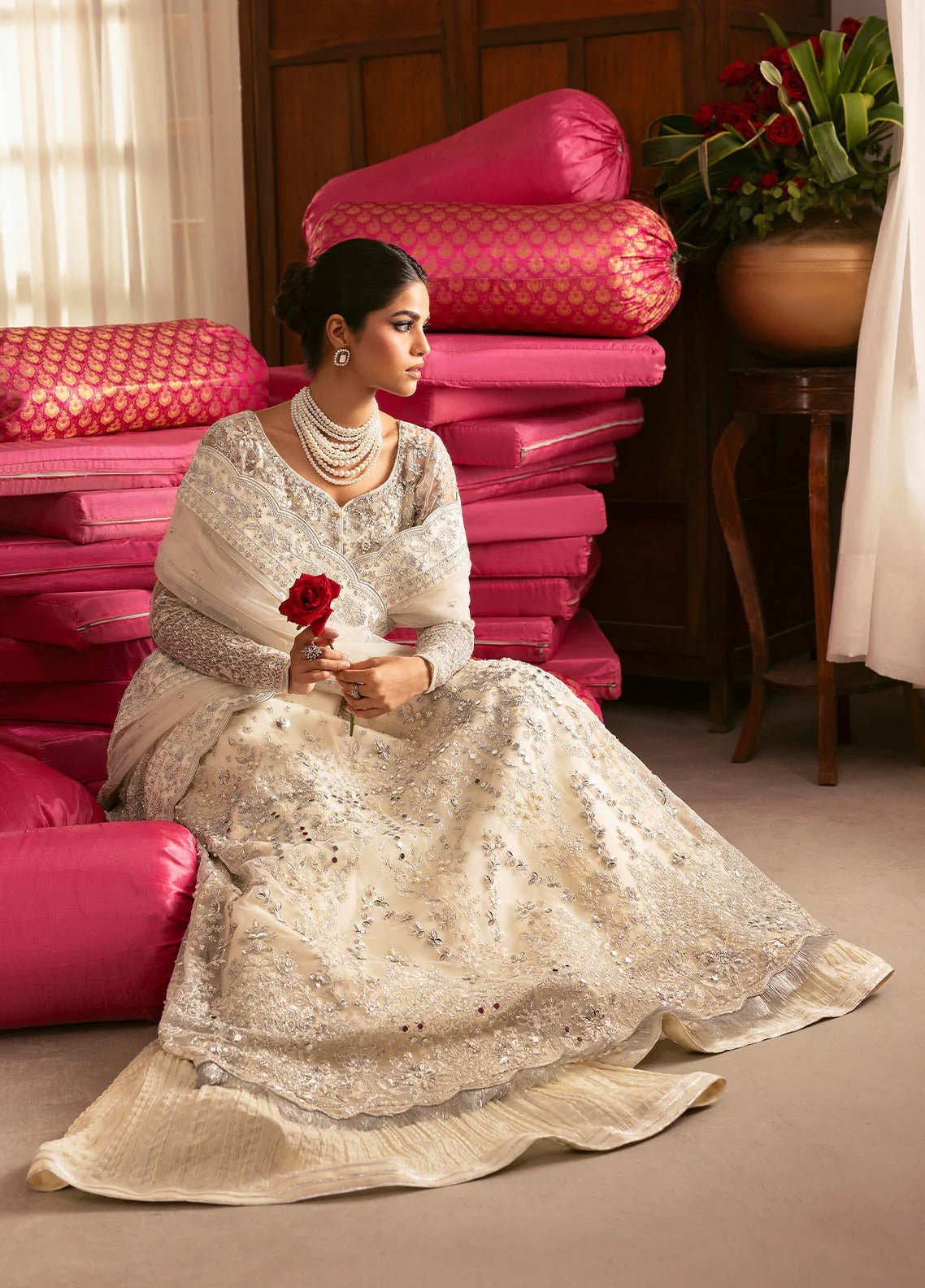 Model wearing Gulaal Sitara ivory silver embroidered chiffon dress with intricate embellishments and matching dupatta. Shop Pakistani clothes online in the UK now.