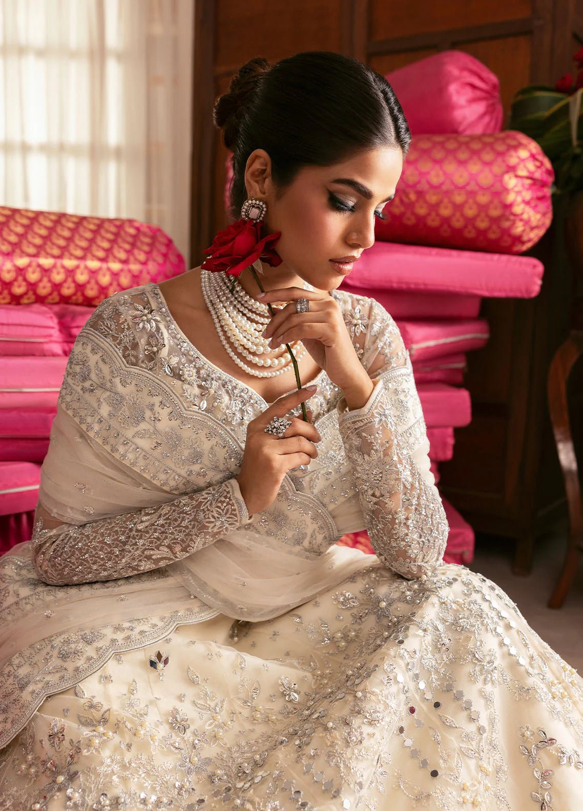 Model wearing Gulaal Sitara ivory silver embroidered chiffon dress with intricate embellishments and matching dupatta. Shop Pakistani clothes online in the UK now.