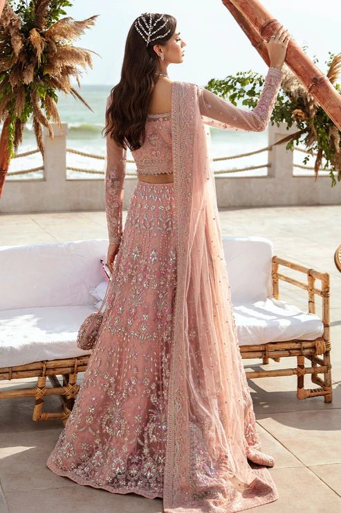 Model wearing Gulaal Azrina - GL - LP - 24V2 - 33 dress in soft pink from Emalyn Luxury Formals, ideal for weddings. Available for Pakistani clothes online in the UK.