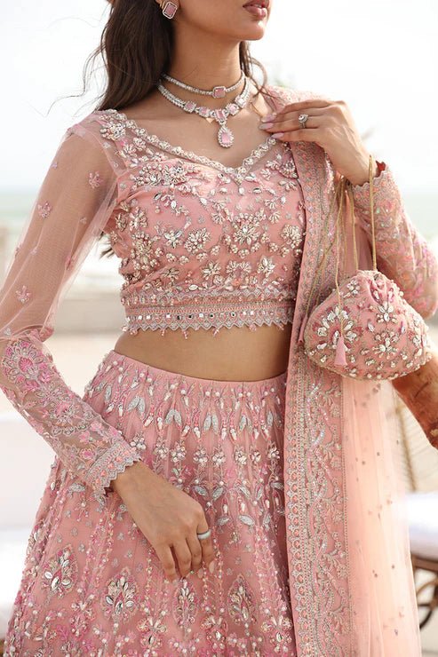 Model wearing Gulaal Azrina - GL - LP - 24V2 - 33 dress in soft pink from Emalyn Luxury Formals, ideal for weddings. Available for Pakistani clothes online in the UK.