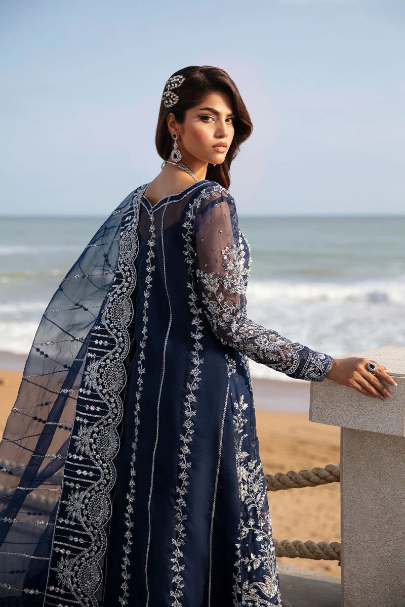 Model wearing Gulaal Celia - GL - LP - 24V2 - 30 dress in navy blue from Emalyn Luxury Formals, perfect for weddings and available for Pakistani clothes online in the UK.