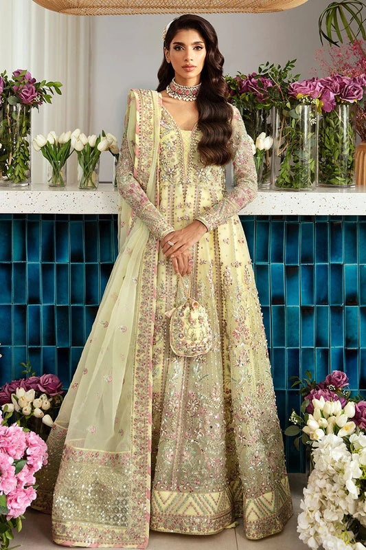 Model wearing Gulaal Noura - GL - LP - 24V2 - 35 dress in soft pastel yellow from Emalyn Luxury Formals, perfect for weddings and Pakistani clothes online in the UK.