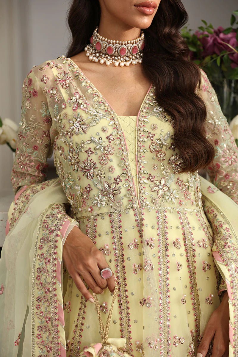 Model wearing Gulaal Noura - GL - LP - 24V2 - 35 dress in soft pastel yellow from Emalyn Luxury Formals, perfect for weddings and Pakistani clothes online in the UK.