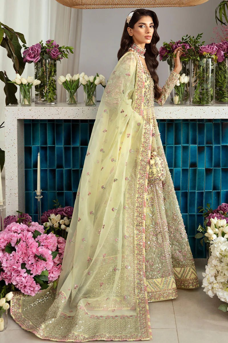 Model wearing Gulaal Noura - GL - LP - 24V2 - 35 dress in soft pastel yellow from Emalyn Luxury Formals, perfect for weddings and Pakistani clothes online in the UK.