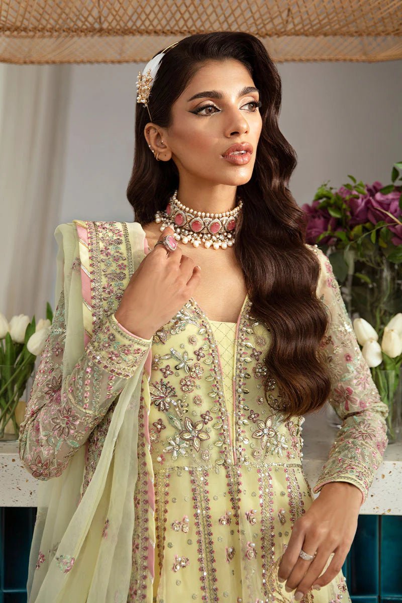 Model wearing Gulaal Noura - GL - LP - 24V2 - 35 dress in soft pastel yellow from Emalyn Luxury Formals, perfect for weddings and Pakistani clothes online in the UK.