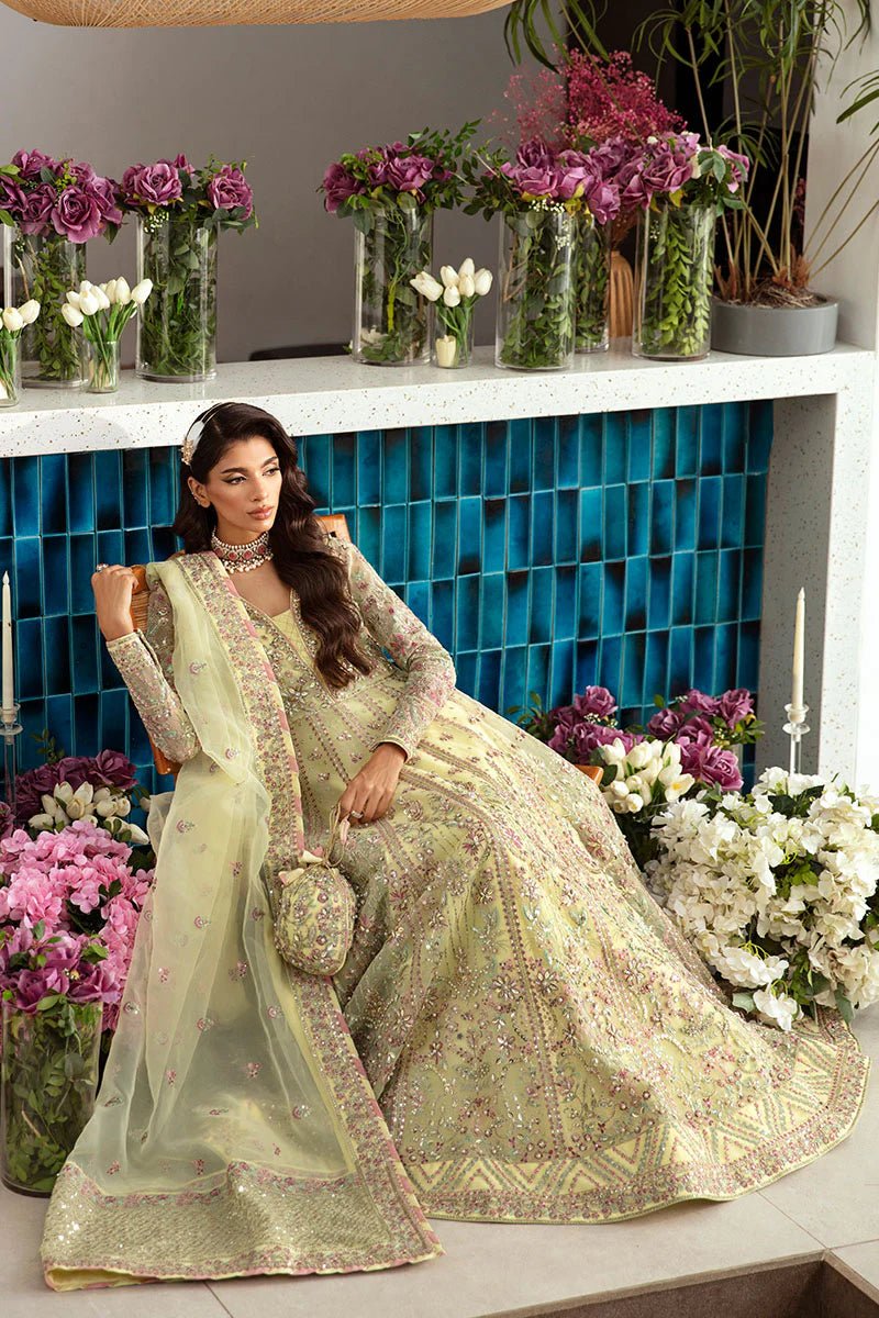 Model wearing Gulaal Noura - GL - LP - 24V2 - 35 dress in soft pastel yellow from Emalyn Luxury Formals, perfect for weddings and Pakistani clothes online in the UK.