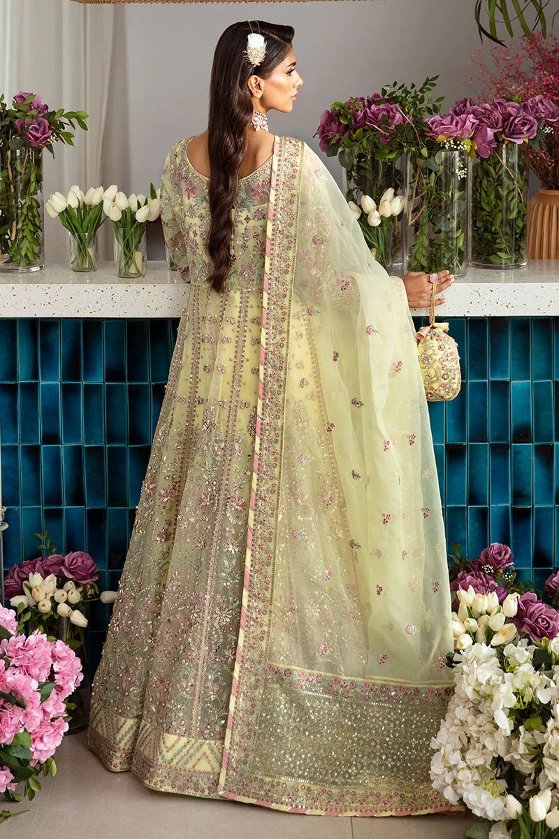 Model wearing Gulaal Noura - GL - LP - 24V2 - 35 dress in soft pastel yellow from Emalyn Luxury Formals, perfect for weddings and Pakistani clothes online in the UK.