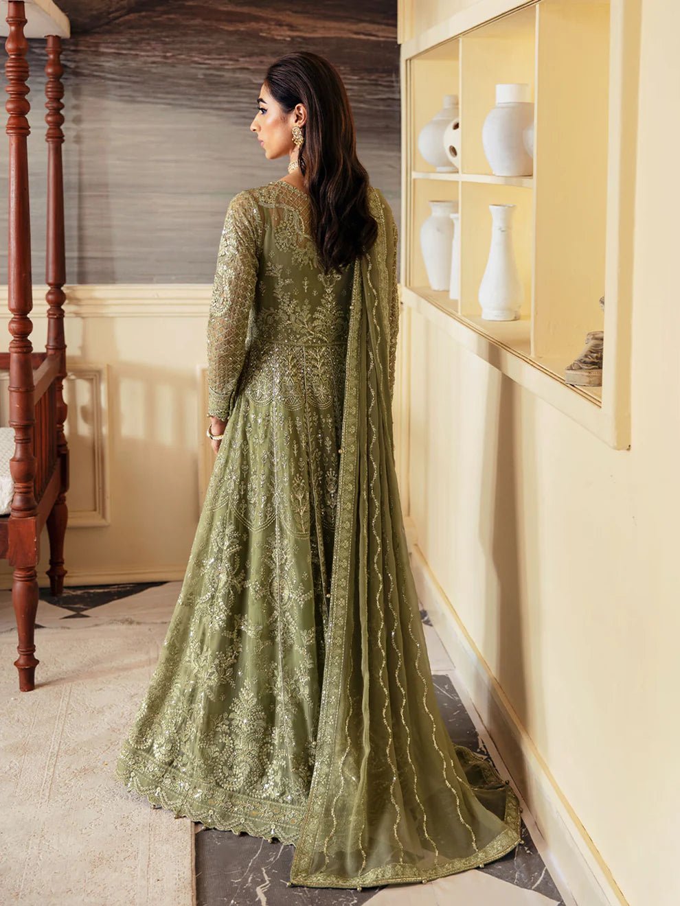 Model wearing an olive green Aysa GL - EC - 23V1 - 07 dress from Gulaal's Embroidered Chiffon '23 V1 collection, showcasing Pakistani clothes online in the UK.