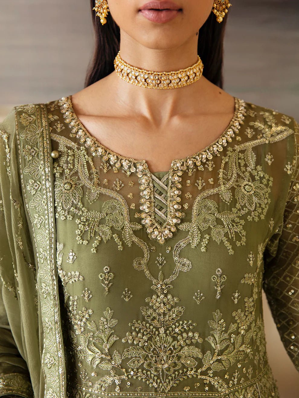 Model wearing an olive green Aysa GL - EC - 23V1 - 07 dress from Gulaal's Embroidered Chiffon '23 V1 collection, showcasing Pakistani clothes online in the UK.