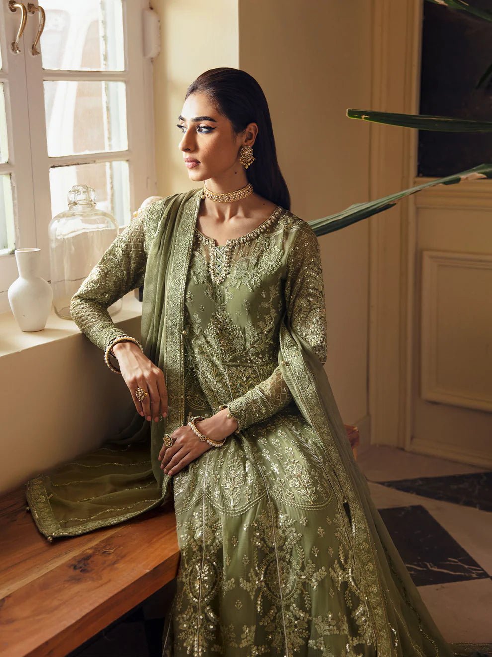 Model wearing an olive green Aysa GL - EC - 23V1 - 07 dress from Gulaal's Embroidered Chiffon '23 V1 collection, showcasing Pakistani clothes online in the UK.