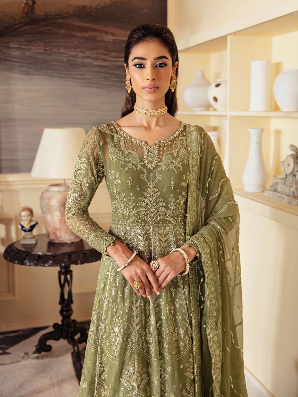 Model wearing an olive green Aysa GL - EC - 23V1 - 07 dress from Gulaal's Embroidered Chiffon '23 V1 collection, showcasing Pakistani clothes online in the UK.