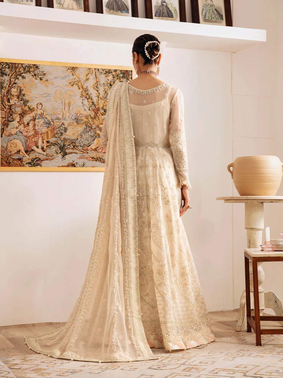 Model wearing an ivory Royale GL - EC - 23V1 - 01 dress from Gulaal's Embroidered Chiffon '23 V1 collection, showcasing Pakistani clothes online in the UK.