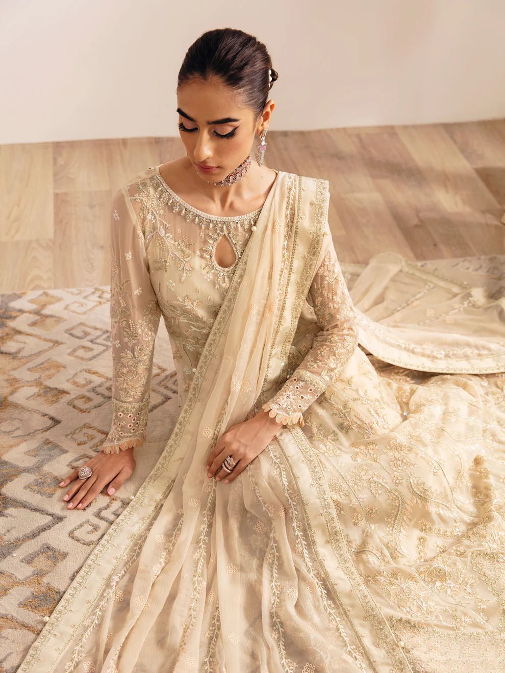 Model wearing an ivory Royale GL - EC - 23V1 - 01 dress from Gulaal's Embroidered Chiffon '23 V1 collection, showcasing Pakistani clothes online in the UK.