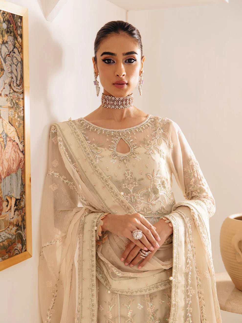 Model wearing an ivory Royale GL - EC - 23V1 - 01 dress from Gulaal's Embroidered Chiffon '23 V1 collection, showcasing Pakistani clothes online in the UK.