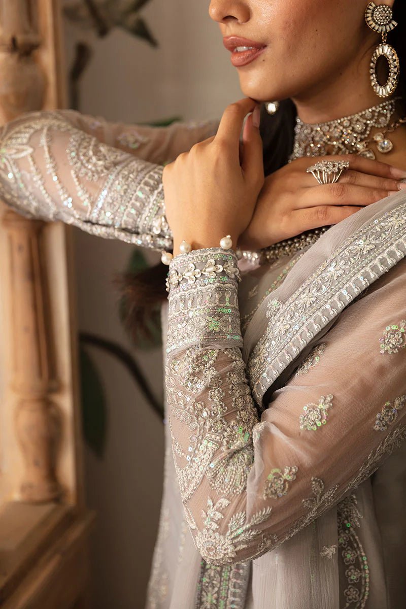 Model wearing Gulaal Embroidered Chiffon 24 Aubrey dress in silver grey, Pakistani wedding clothes online in UK.