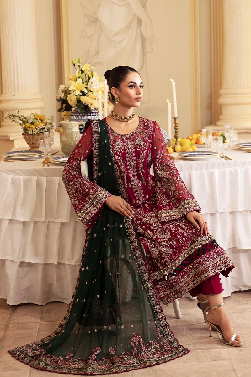 Model wearing Gulaal Embroidered Chiffon 24 Blanca dress in maroon and green, Pakistani wedding clothes online in UK.