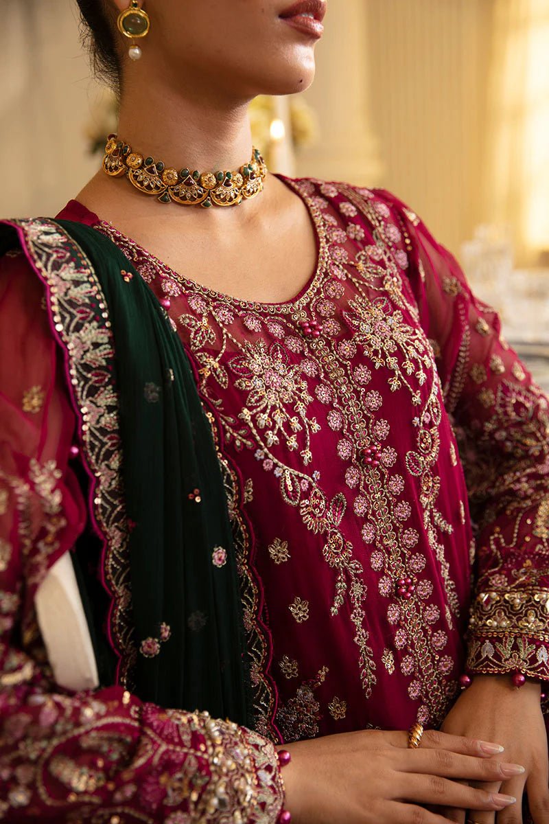 Model wearing Gulaal Embroidered Chiffon 24 Blanca dress in maroon and green, Pakistani wedding clothes online in UK.