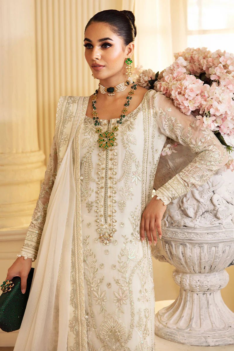 Model wearing Gulaal Embroidered Chiffon 24 Delphine dress in ivory, Pakistani wedding clothes online in UK.