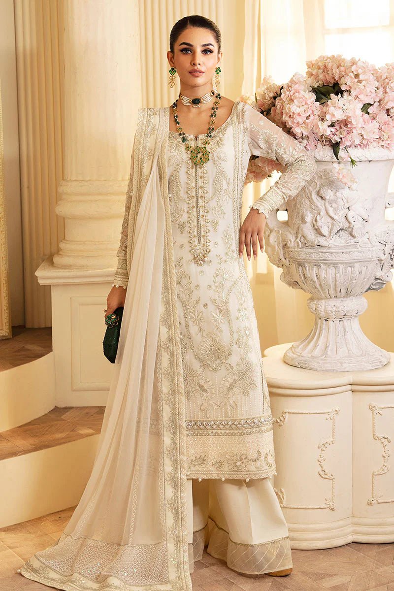 Model wearing Gulaal Embroidered Chiffon 24 Delphine dress in ivory, Pakistani wedding clothes online in UK.