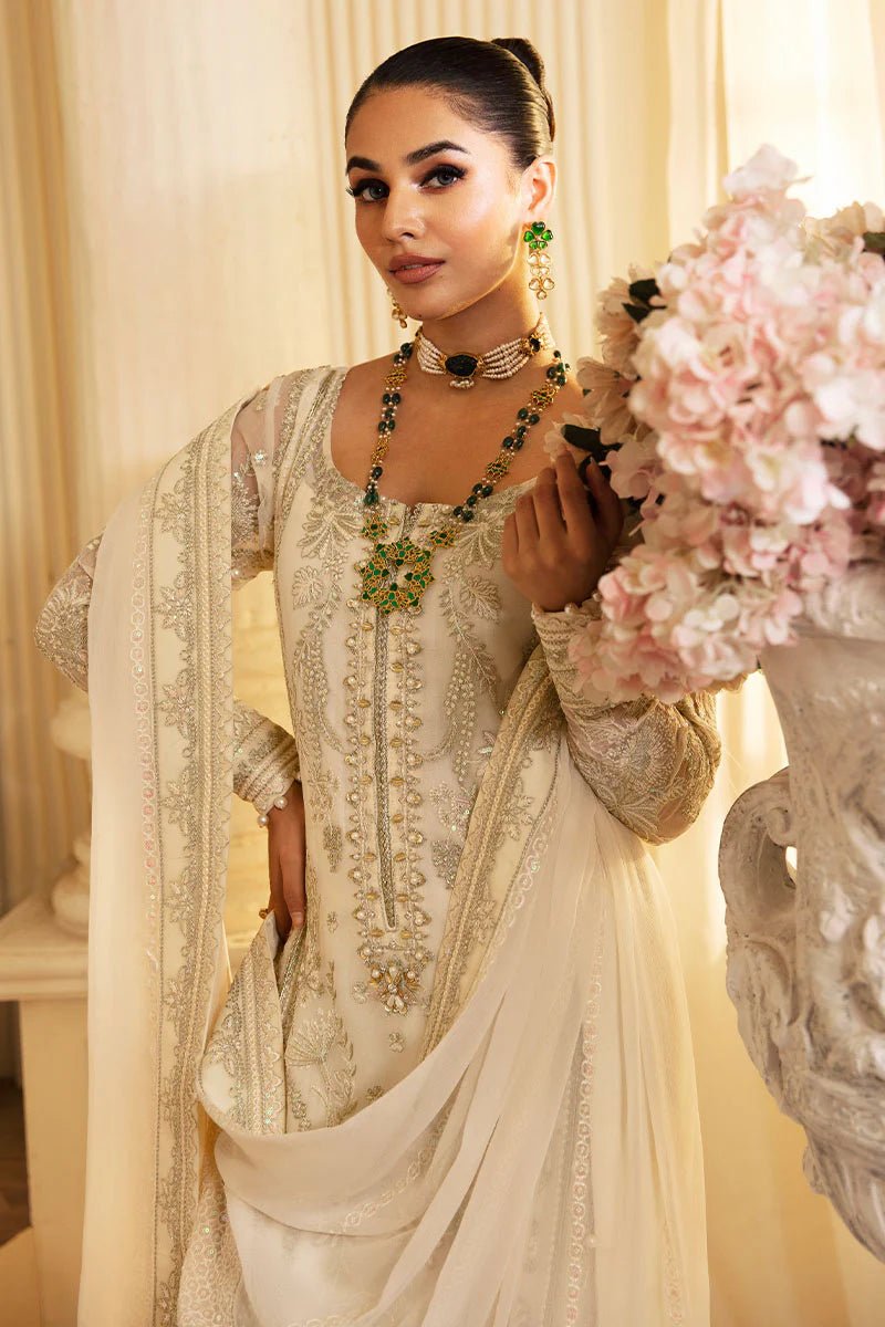 Model wearing Gulaal Embroidered Chiffon 24 Delphine dress in ivory, Pakistani wedding clothes online in UK.