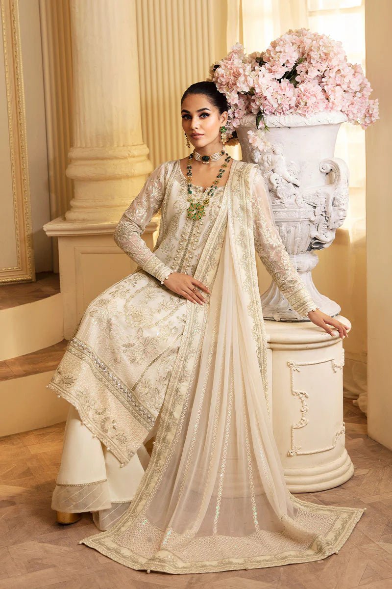 Model wearing Gulaal Embroidered Chiffon 24 Delphine dress in ivory, Pakistani wedding clothes online in UK.