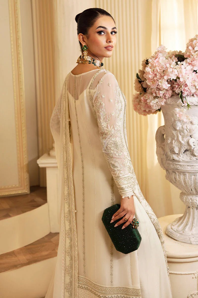 Model wearing Gulaal Embroidered Chiffon 24 Delphine dress in ivory, Pakistani wedding clothes online in UK.