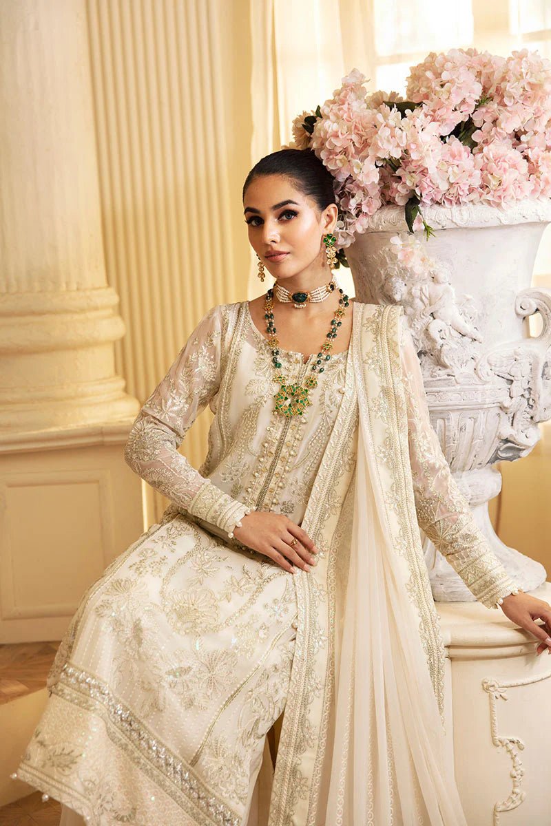 Model wearing Gulaal Embroidered Chiffon 24 Delphine dress in ivory, Pakistani wedding clothes online in UK.