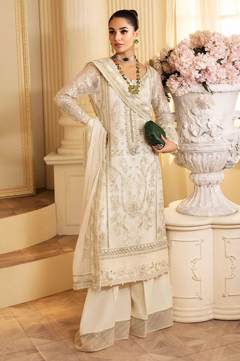 Model wearing Gulaal Embroidered Chiffon 24 Delphine dress in ivory, Pakistani wedding clothes online in UK.