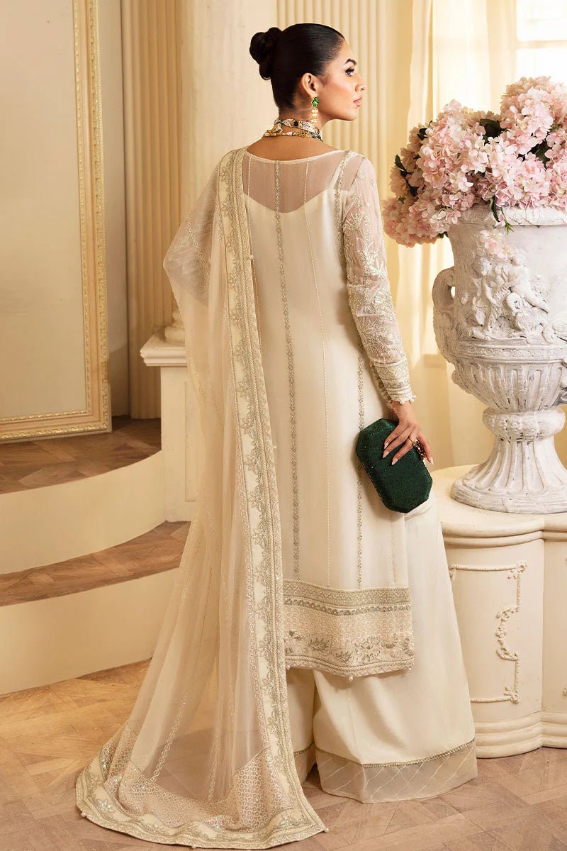 Model wearing Gulaal Embroidered Chiffon 24 Delphine dress in ivory, Pakistani wedding clothes online in UK.