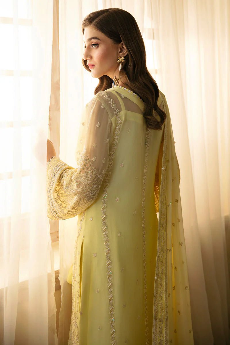 Model wearing Gulaal Embroidered Chiffon 24 Estrella dress in light yellow, showcasing Pakistani wedding clothes online in the UK.