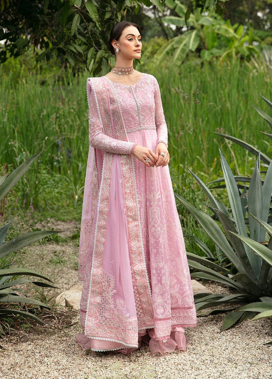 Model wearing Gulaal Amour pink chiffon Eid dress, Suffuse detail, sought - after Pakistani clothes UK.