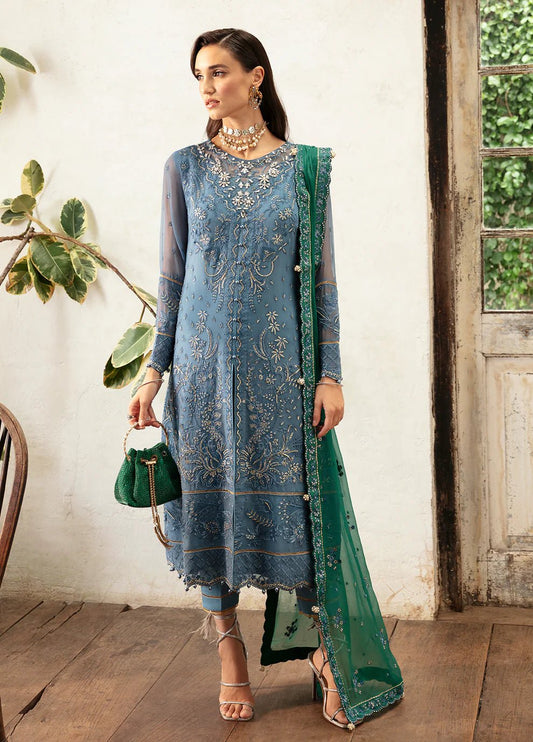 Model wearing Gulaal Helia blue chiffon Eid dress, Suffuse embroidery, Pakistani clothes UK.