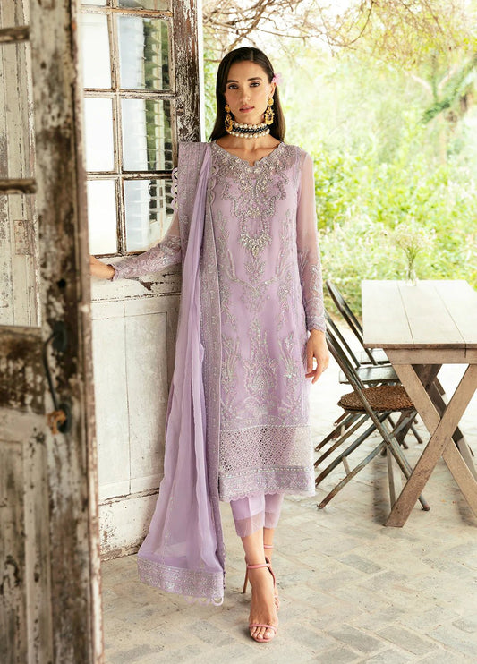 Model wearing Gulaal Viola lavender embroidered Eid dress, Suffuse accents, luxe Pakistani clothes UK.