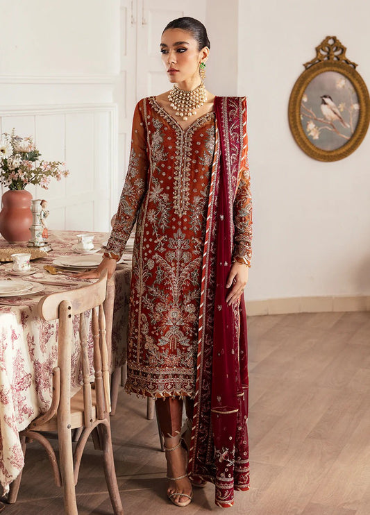 Model wearing a maroon LAIRA dress with intricate silver embroidery and maroon dupatta from Gulaal's Embroidered Chiffon V2 collection. Ideal for showcasing Pakistani clothes online in the UK.