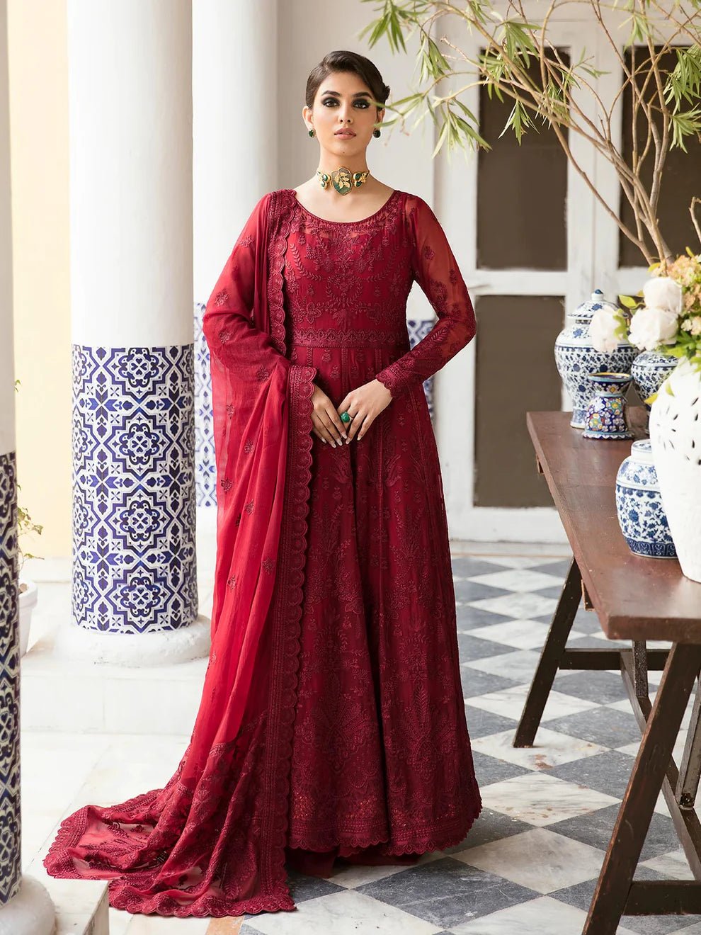 Model wearing a rich red Garnet dress from Gulaal's Embroidered Pret '23 V1 collection, showcasing Pakistani clothes online in the UK.