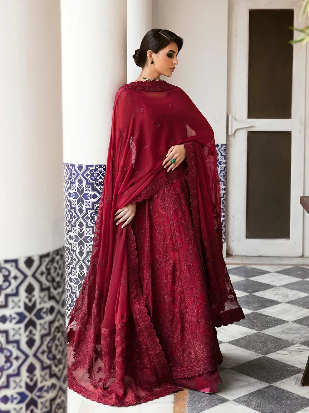 Model wearing a rich red Garnet dress from Gulaal's Embroidered Pret '23 V1 collection, showcasing Pakistani clothes online in the UK.