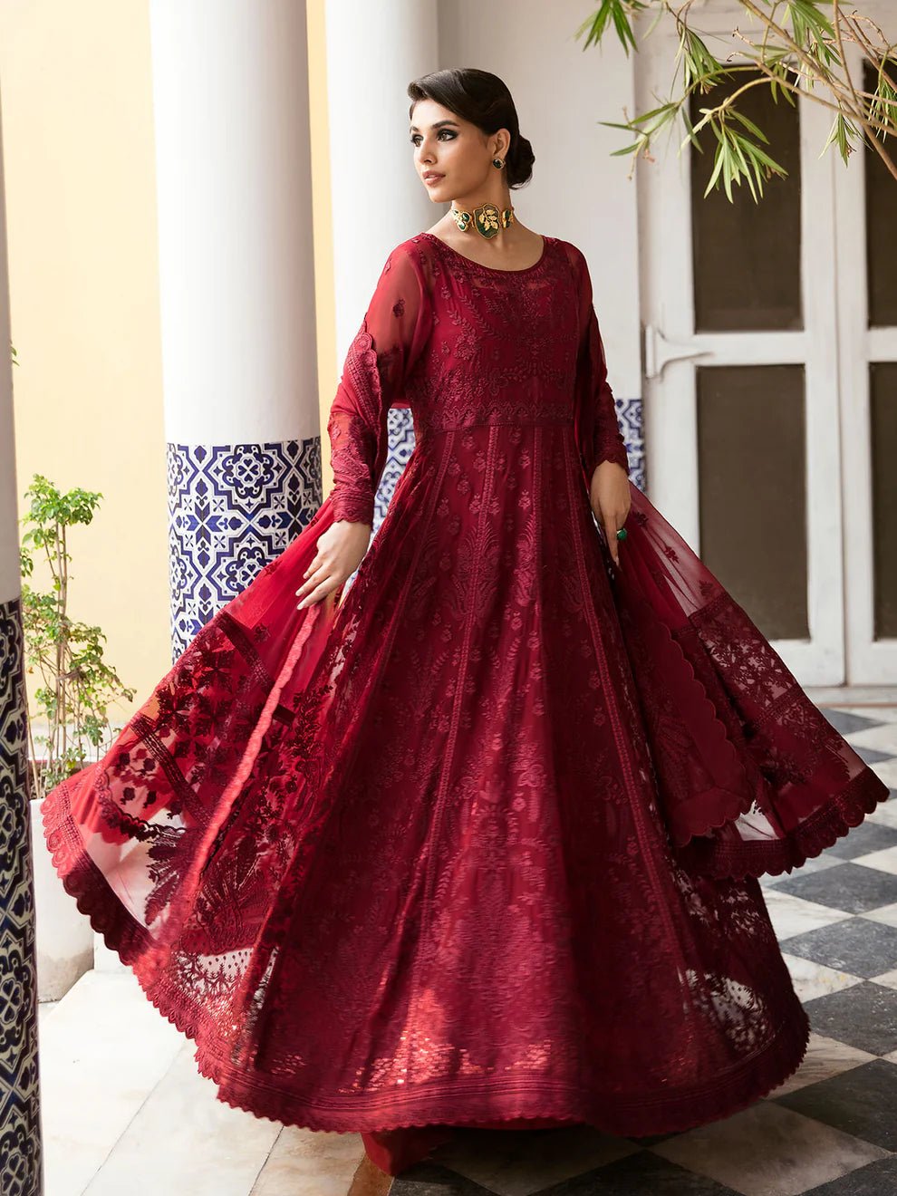 Model wearing a rich red Garnet dress from Gulaal's Embroidered Pret '23 V1 collection, showcasing Pakistani clothes online in the UK.