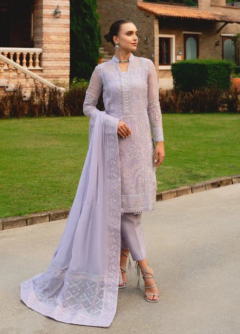 Model wearing Gulaal ARIYA dress, lavender embroidered Pakistani attire UK.
