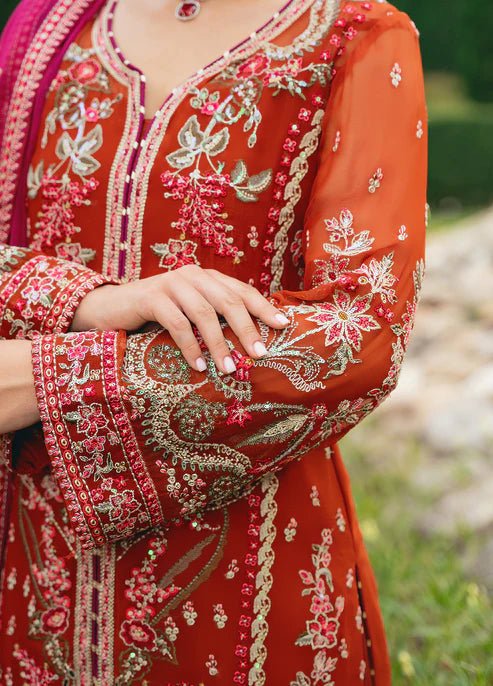 Model wearing Gulaal ATHENA dress, red embroidered Pakistani outfit UK.