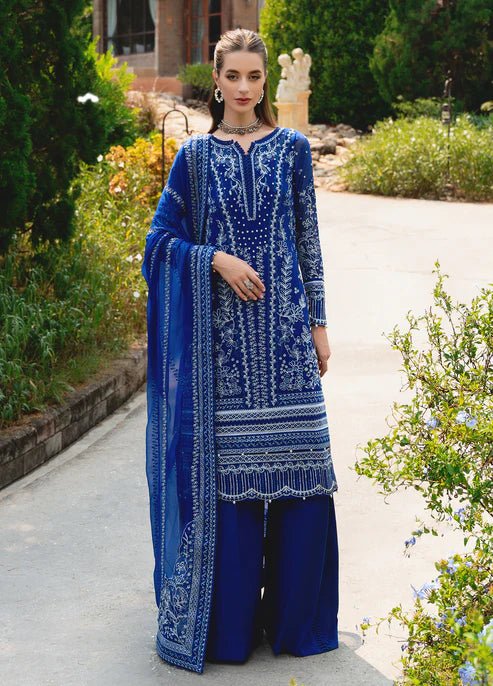 Model wearing Gulaal CELISE dress, royal blue Pakistani attire UK.