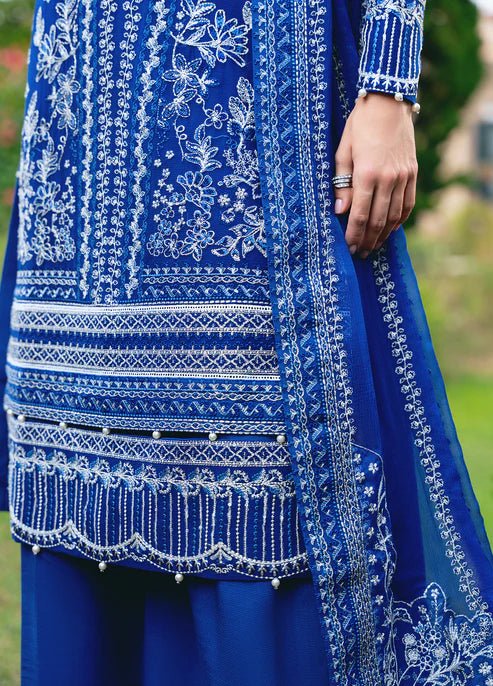 Model wearing Gulaal CELISE dress, royal blue Pakistani attire UK.