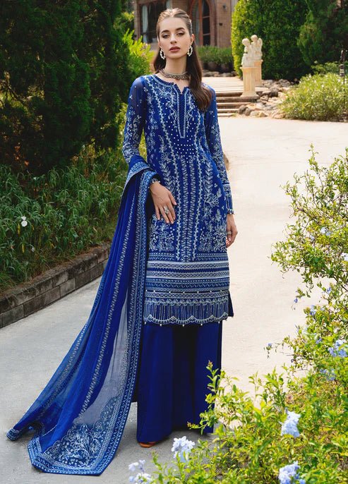 Model wearing Gulaal CELISE dress, royal blue Pakistani attire UK.